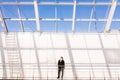 Handsome young man in full suit while standing modern office hall Royalty Free Stock Photo