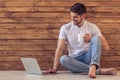 Handsome young man with gadget Royalty Free Stock Photo