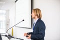 Handsome young man giving a speech