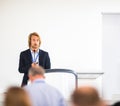 Handsome young man giving a speech