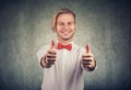 Handsome man giving thumbs up gesture Royalty Free Stock Photo