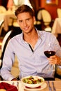 Handsome young man with glass of red wine Royalty Free Stock Photo