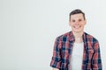 Happy young man. Portrait of handsome young man keeping arms crossed and smiling Royalty Free Stock Photo