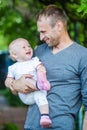 Handsome young man having fun outdoors with little cute girl. Toddler smiles. Happy Father`s Day. I love you dad Royalty Free Stock Photo