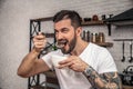 Handsome young man is having his breakfast cereal with milk. he is enjoying breakfast smiling Royalty Free Stock Photo