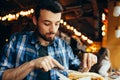 Handsome young man having lunch in elegant restaurant alone Royalty Free Stock Photo