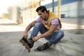 Handsome young man with inline roller skates Royalty Free Stock Photo