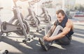 Handsome young man lace shoes at gym after training Royalty Free Stock Photo