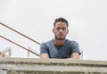 Man leaning on parapet