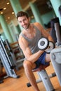 Handsome young man lifting weights Royalty Free Stock Photo