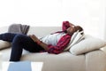 Handsome young man listening to music with headphones at home. Royalty Free Stock Photo