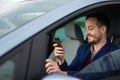 Handsome young man looking at his cellphone Royalty Free Stock Photo