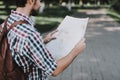 Handsome Young Man Looking at Paper Map Outdoors Royalty Free Stock Photo