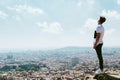 Handsome young man looking at the views form the top of a mountain. Royalty Free Stock Photo