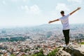 Handsome young man looking at the views form the top of a mountain. Royalty Free Stock Photo