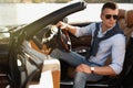 Handsome young man in luxury convertible car Royalty Free Stock Photo