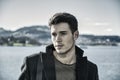 Handsome young man on Luzern lake's shore Royalty Free Stock Photo