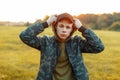 Handsome young man in a military jacket with a hat Royalty Free Stock Photo