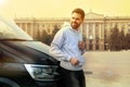 Handsome young man near modern car Royalty Free Stock Photo