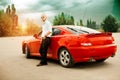 Handsome young man near sport car Royalty Free Stock Photo