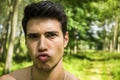 Handsome young man outdoor doing silly face Royalty Free Stock Photo