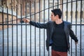 Handsome young man outside historical building in European city Royalty Free Stock Photo