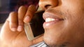 Close up of a Handsome Young Man on a Phone Call