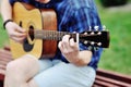 Handsome young man playing guitar Royalty Free Stock Photo