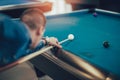 Handsome young man playing pool in pub Royalty Free Stock Photo