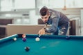 Young man playing pool in pub Royalty Free Stock Photo