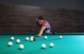 Handsome young man playing Russian billiard