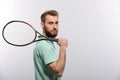 Handsome young man in polo shirt holding tennis Royalty Free Stock Photo