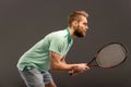 Handsome young man in polo shirt holding tennis Royalty Free Stock Photo