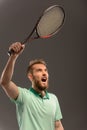 Handsome young man in polo shirt holding tennis Royalty Free Stock Photo