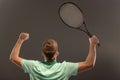 Handsome young man in polo shirt holding tennis Royalty Free Stock Photo