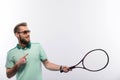 Handsome young man in polo shirt holding tennis Royalty Free Stock Photo