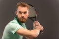 Handsome young man in polo shirt holding tennis Royalty Free Stock Photo