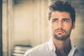 Handsome young man portrait. Intense look and eye-catching beauty