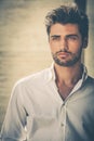 Handsome young man portrait. Intense look and eye-catching beauty