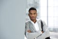 Handsome young man posing with bag at airport Royalty Free Stock Photo