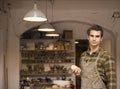 Handsome young man posing in pottery workshop Royalty Free Stock Photo