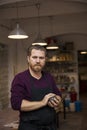 Handsome young man posing in pottery workshop Royalty Free Stock Photo