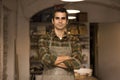 Handsome young man posing in pottery workshop Royalty Free Stock Photo