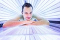 Handsome young man relaxing in a modern solarium Royalty Free Stock Photo