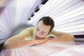 Handsome young man relaxing in a solarium Royalty Free Stock Photo