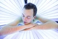 Handsome young man relaxing in a solarium Royalty Free Stock Photo