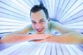 Handsome young man relaxing in a solarium Royalty Free Stock Photo