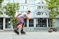 Handsome young man roller skating outdoors.  activity Royalty Free Stock Photo