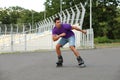 Handsome young man  skating outdoors. Recreational activity Royalty Free Stock Photo