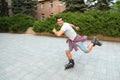 Handsome young man roller skating. Recreational activity Royalty Free Stock Photo